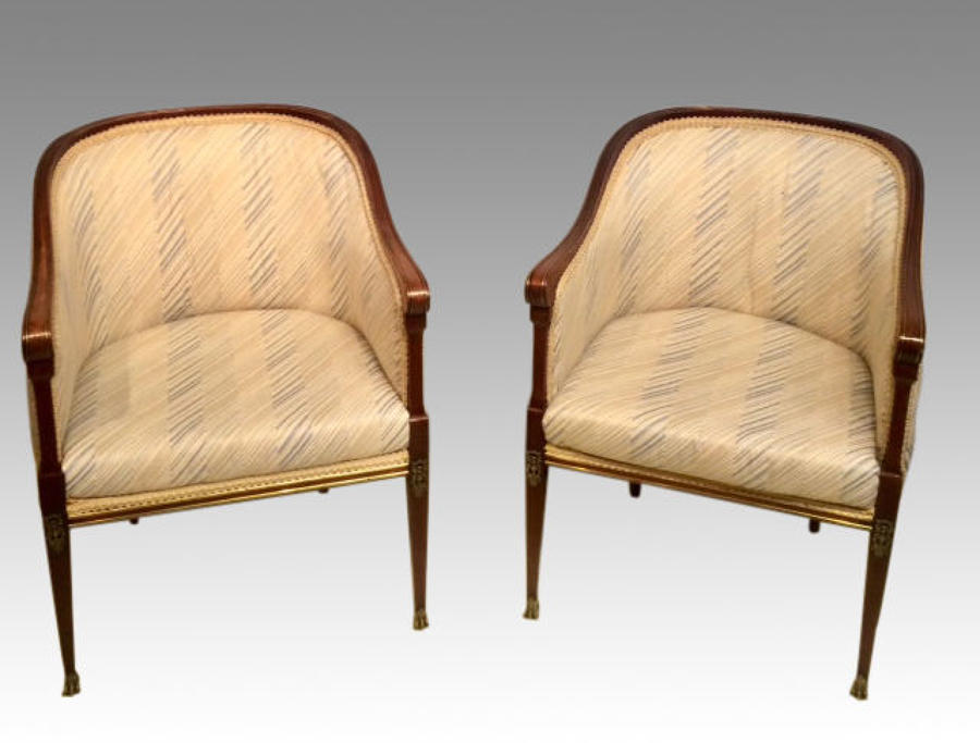 Pair of French empire mahogany armchairs.