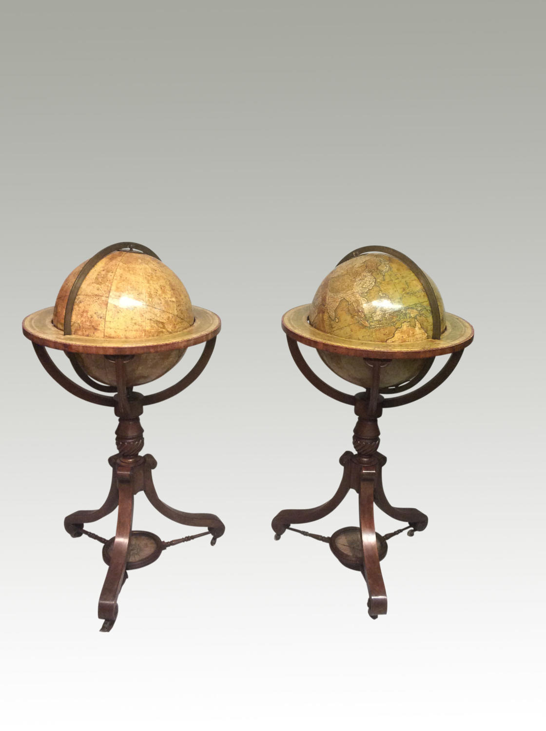 A pair of antique Georgian globes by Newton.