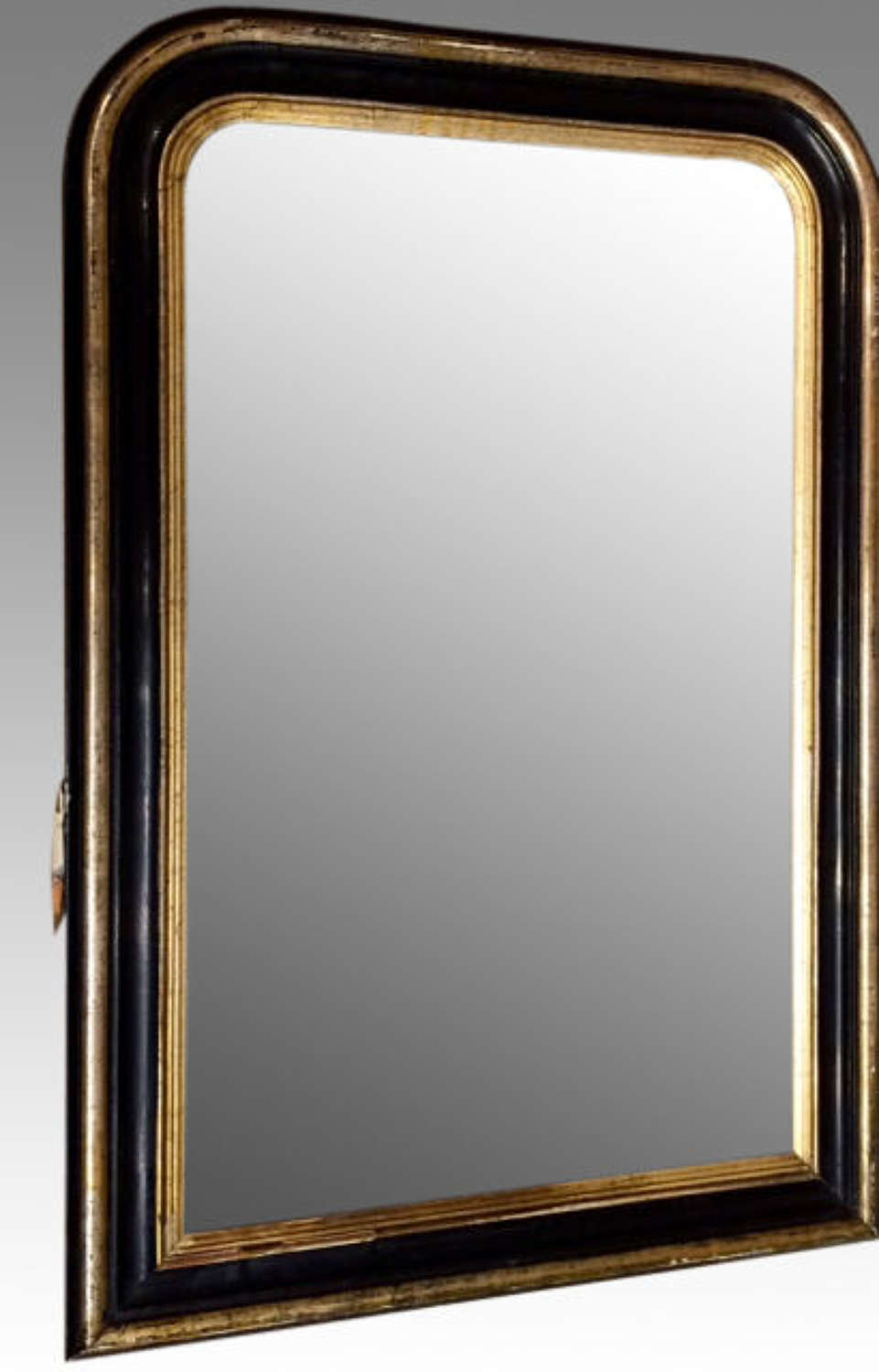 19th century French black and gilt pier mirror.