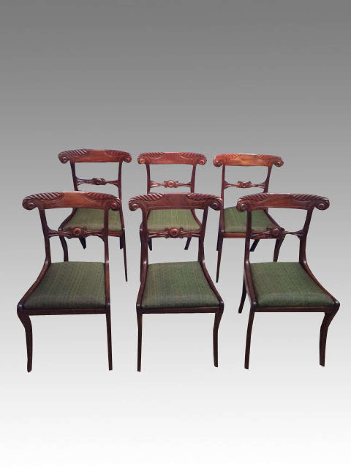A set of 6 antique Regency mahogany dining chairs.