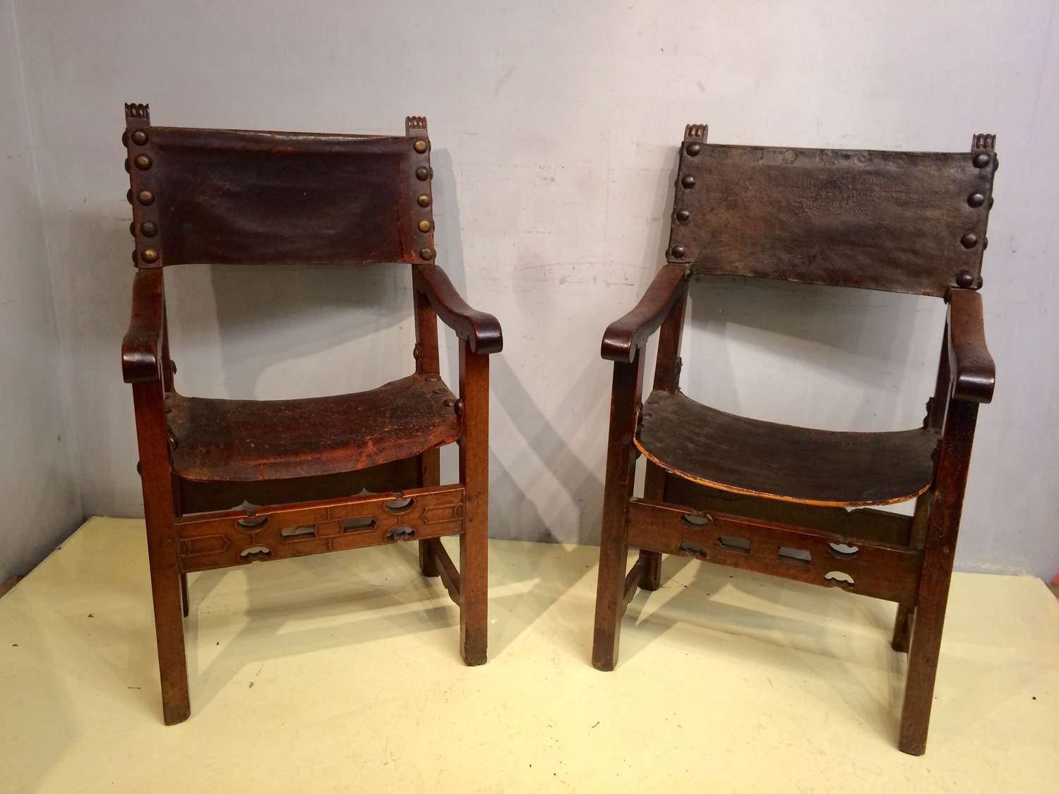 A near pair of  18th century Spanish walnut armchairs.