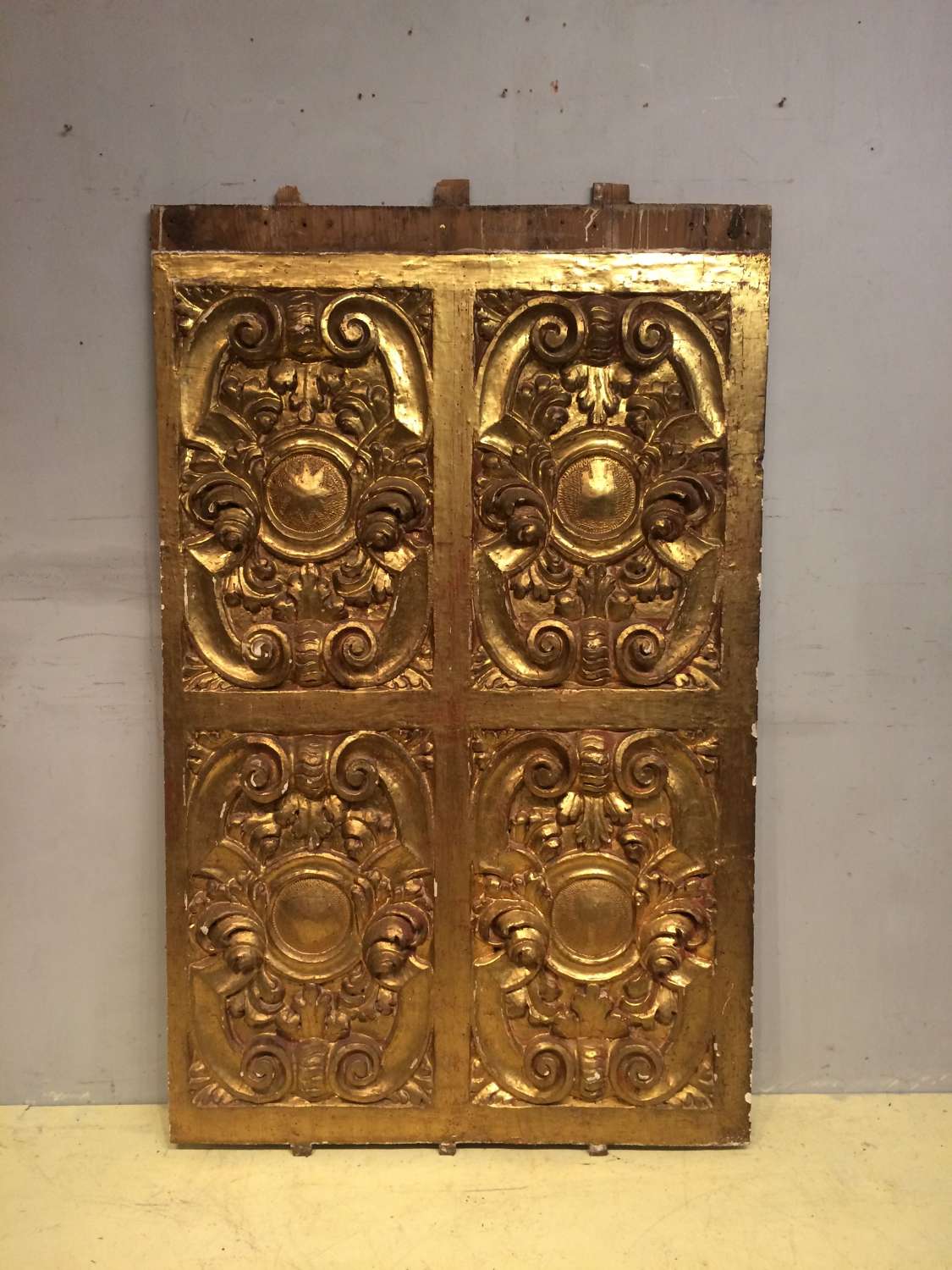 A late 17th century carved giltwood panel.