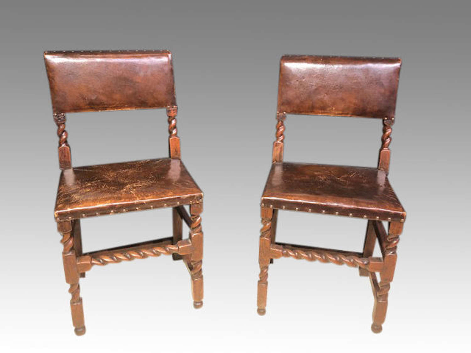 Pair of 17th century oak side chairs.