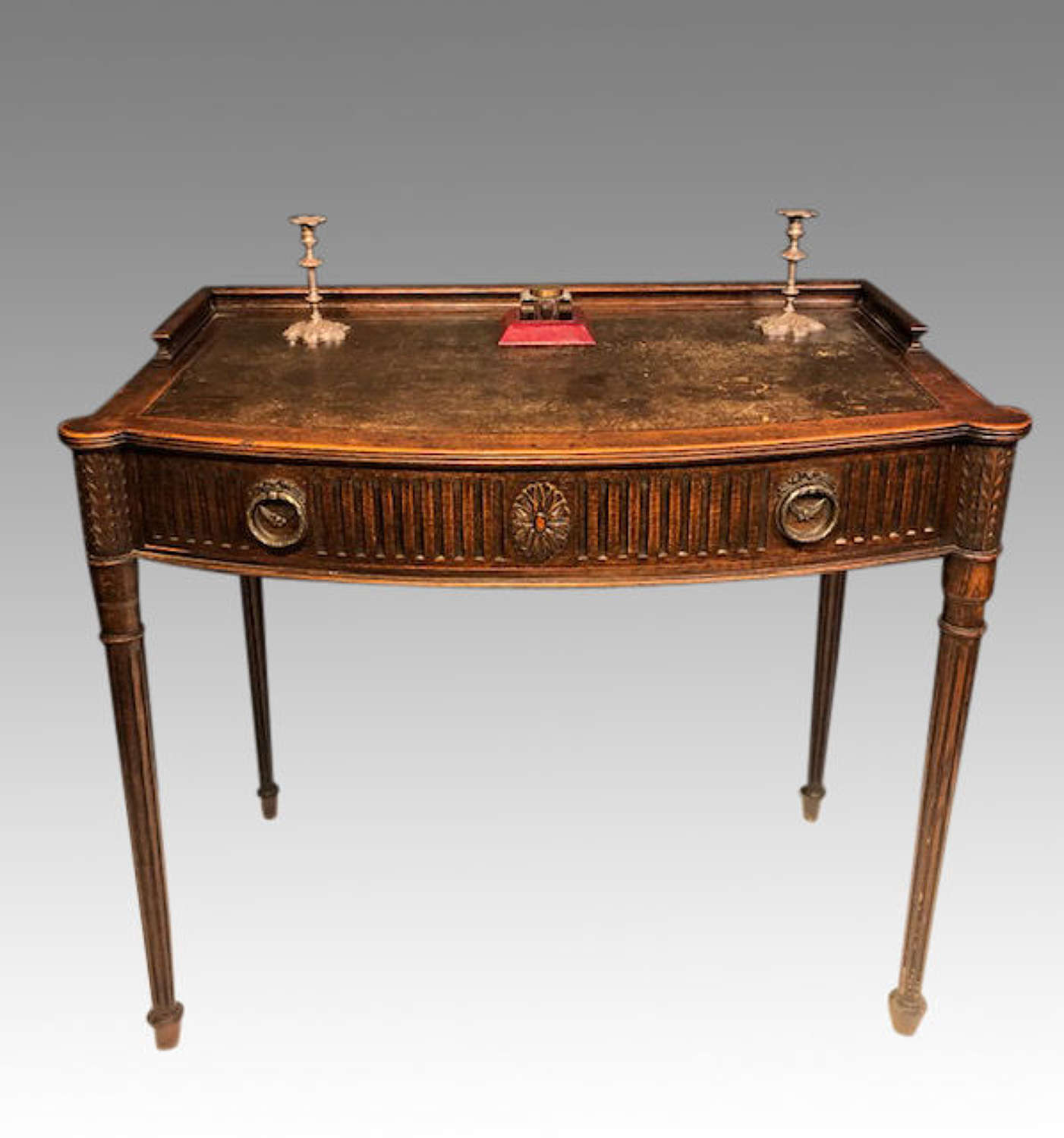19th century oak bow fronted writing table.