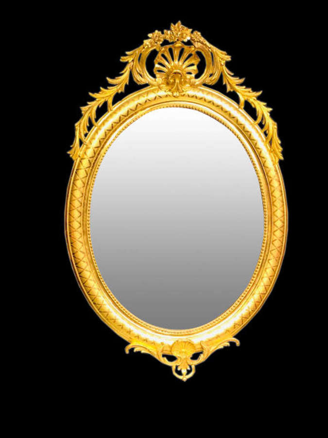 19th century French oval giltwood mirror.
