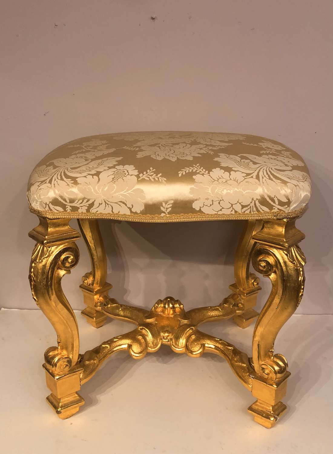 Louis IV style carved cabriole leg giltwood stool.