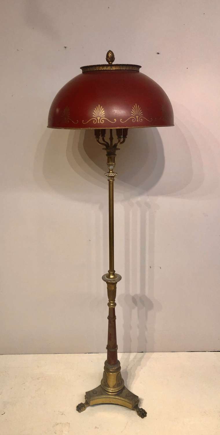 Decorative brass and toleware standard lamp.