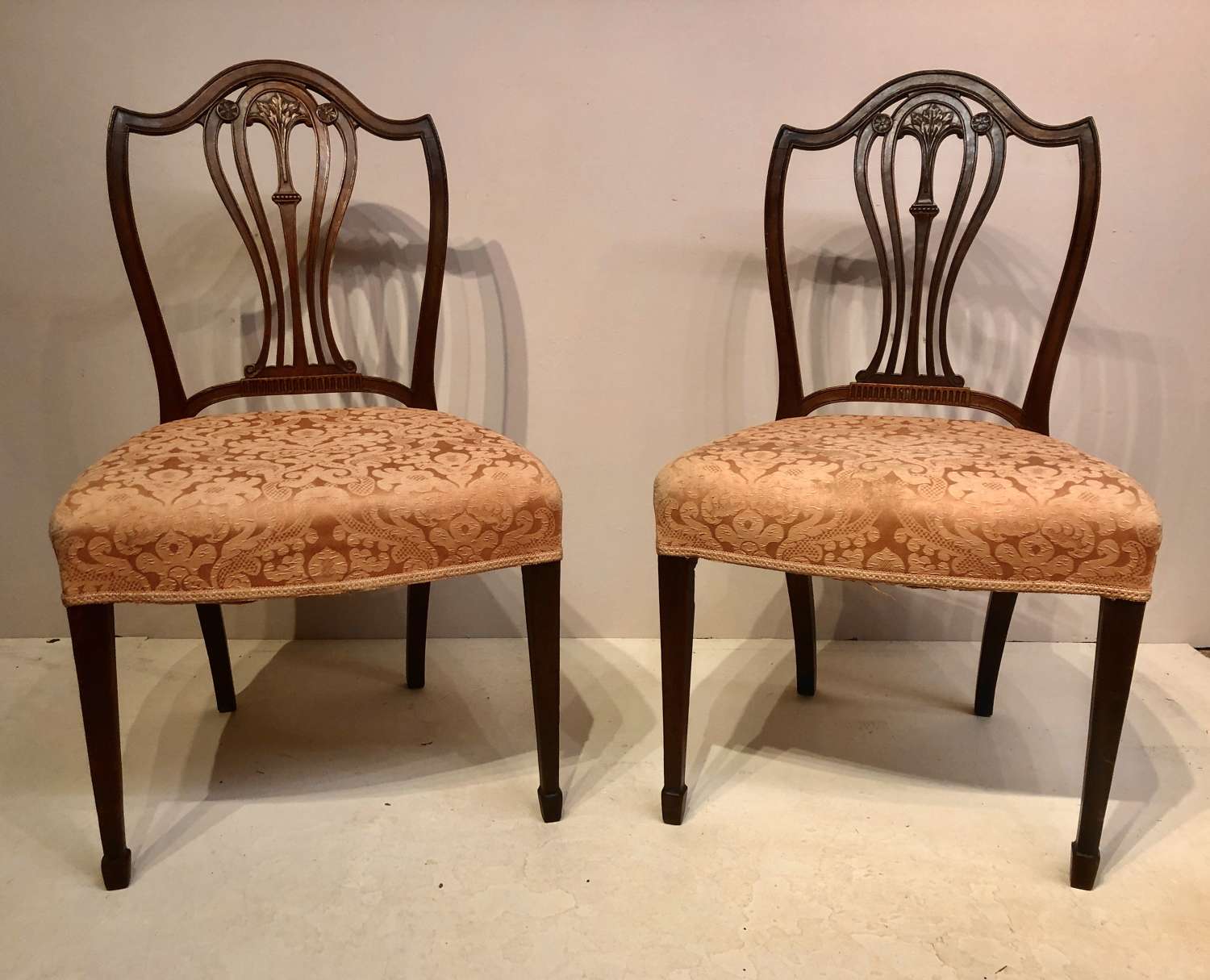 Pair of carved Hepplewhite mahogany side chairs.
