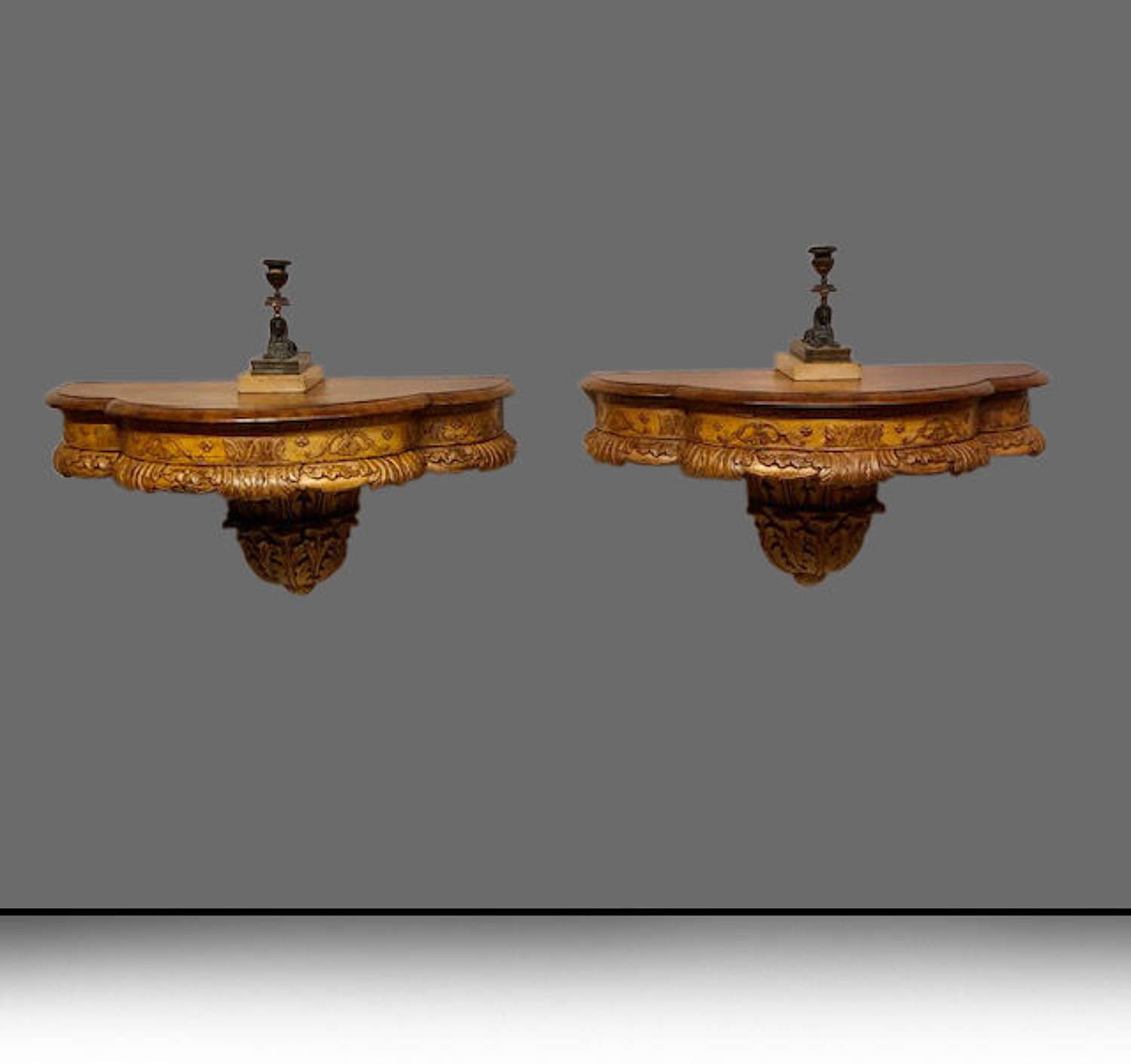 Pair of 19th century walnut and carved giltwood console tables.