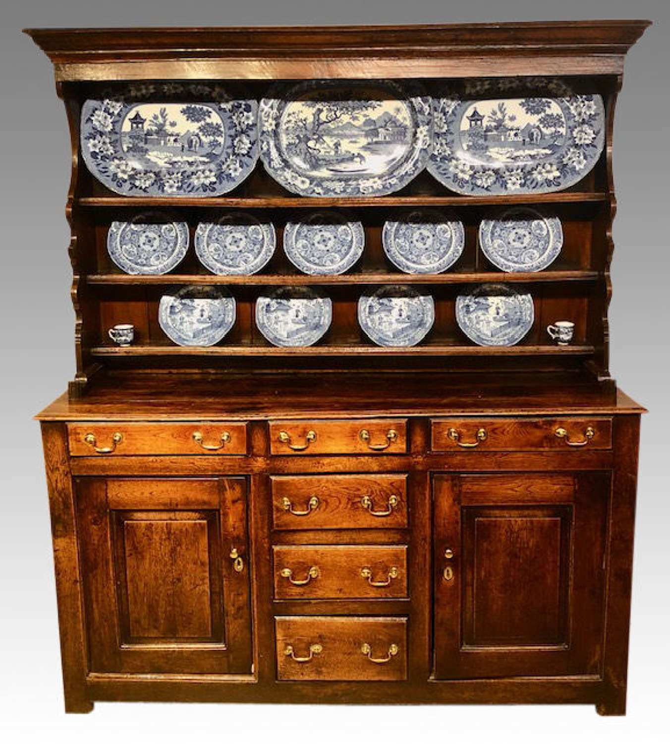 18th century Welsh oak dresser and shelves.