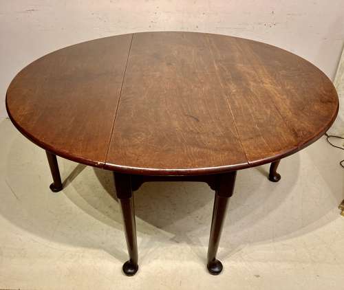 Georgian mahogany drop leaf dining table.