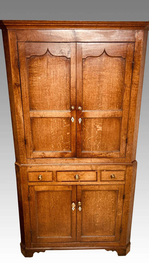Antique Welsh oak corner cupboard.