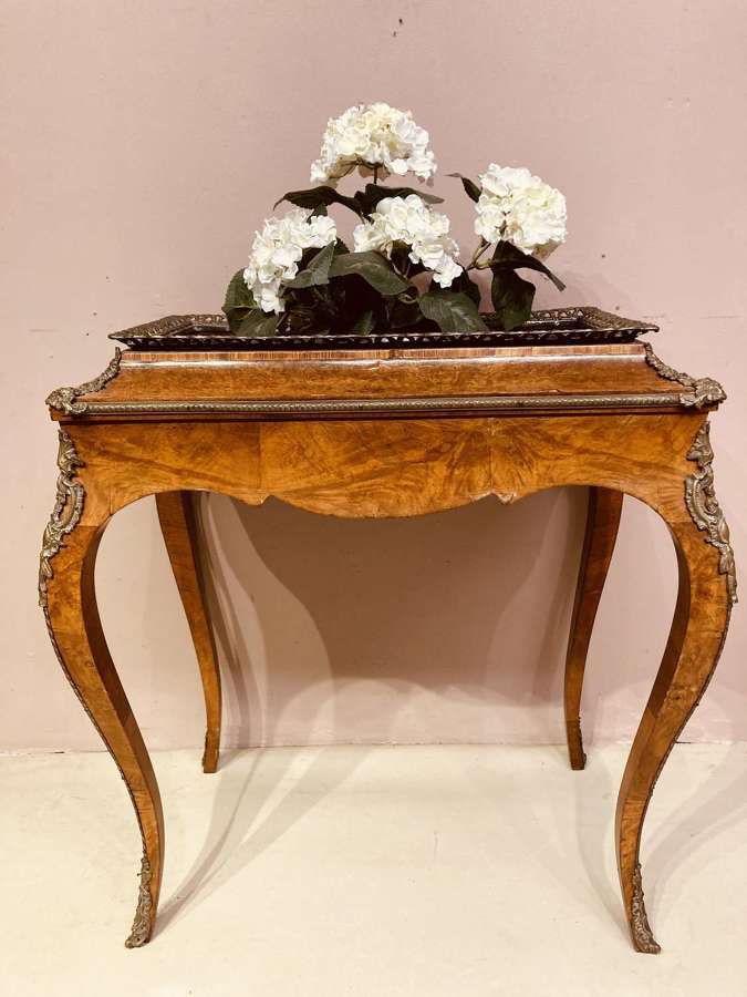 A 19th century walnut gilt mounted jardiniere.