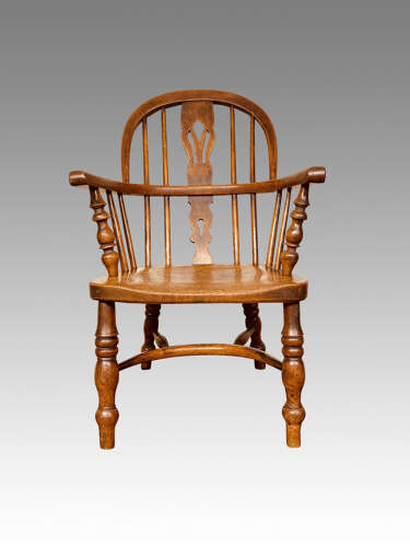 Early 19th century yew and ash child's Windsor armchair.