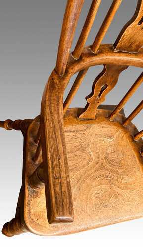 Early 19th century yew and ash child's Windsor armchair.