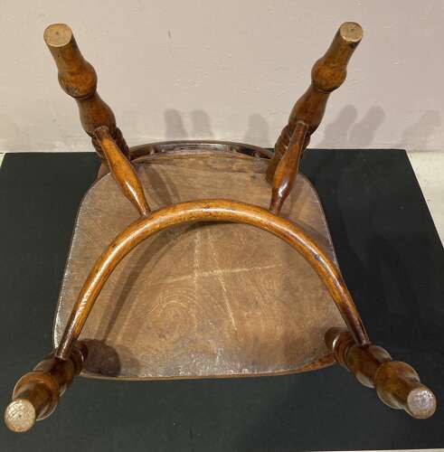 Early 19th century yew and ash child's Windsor armchair.