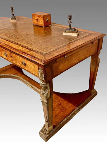 French mahogany and bird’s eye maple writing table.