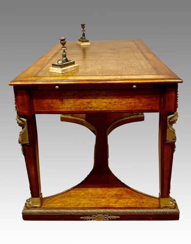 French mahogany and bird’s eye maple writing table.