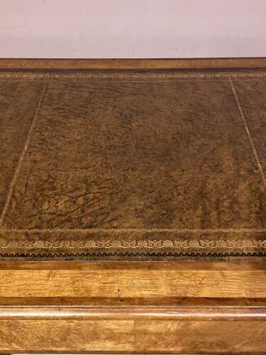 French mahogany and bird’s eye maple writing table.