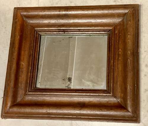 Early oak cushion mirror.