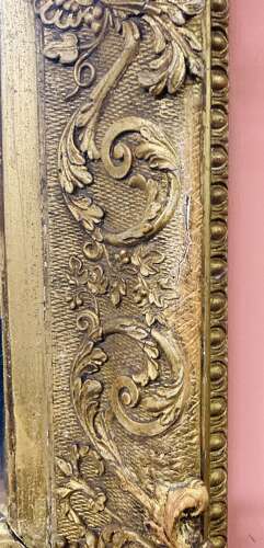 Carved giltwood and gesso wall mirror.