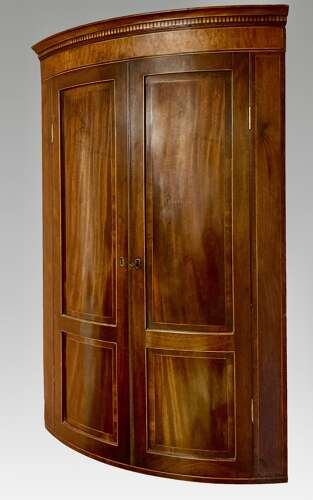 Georgian mahogany bow fronted hanging corner cupboard.