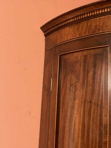 Georgian mahogany bow fronted hanging corner cupboard.