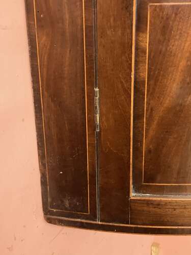 Georgian mahogany bow fronted hanging corner cupboard.