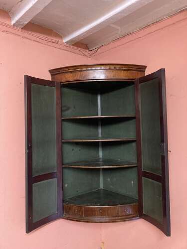 Georgian mahogany bow fronted hanging corner cupboard.