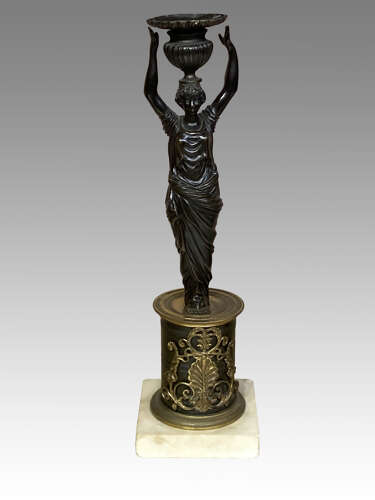 Pair of Regency bronze candlesticks.
