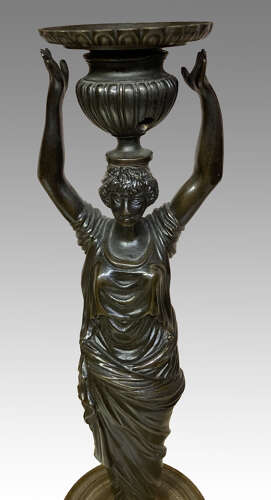 Pair of Regency bronze candlesticks.