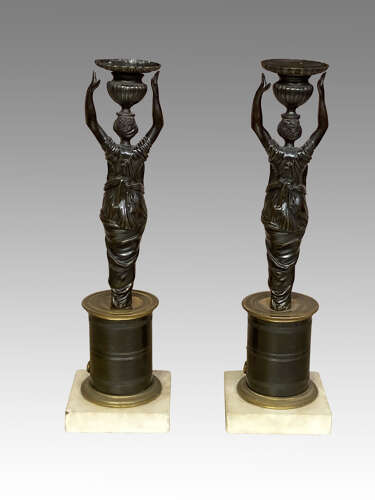 Pair of Regency bronze candlesticks.