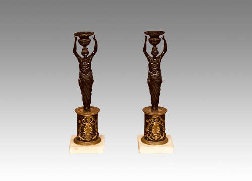 Pair of Regency bronze candlesticks.
