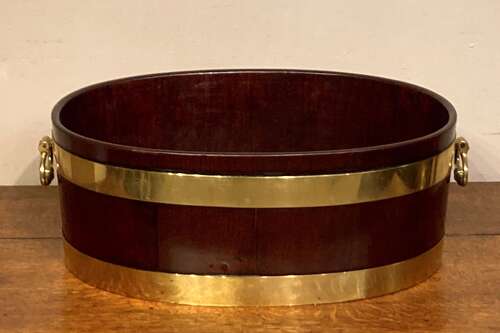 Geo III oval mahogany brass bound planter.