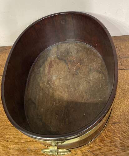 Geo III oval mahogany brass bound planter.