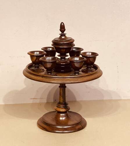 Late Georgian lignum and mahogany revolving egg cruet.