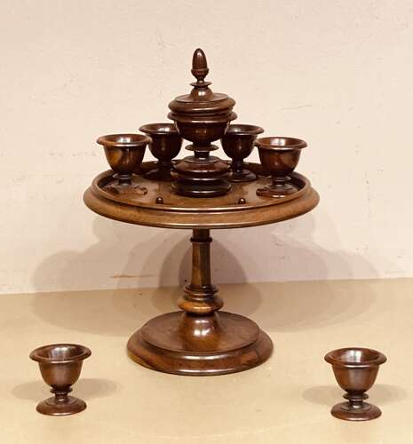 Late Georgian lignum and mahogany revolving egg cruet.