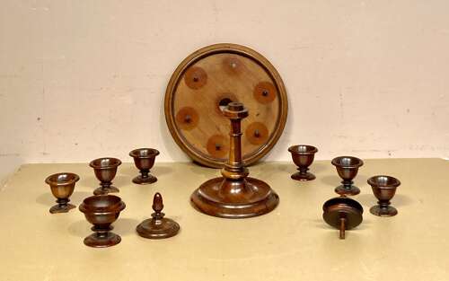 Late Georgian lignum and mahogany revolving egg cruet.