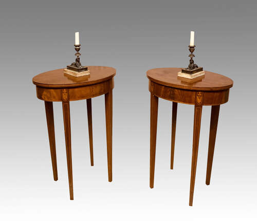 Pair of oval mahogany bedside or lamp tables.