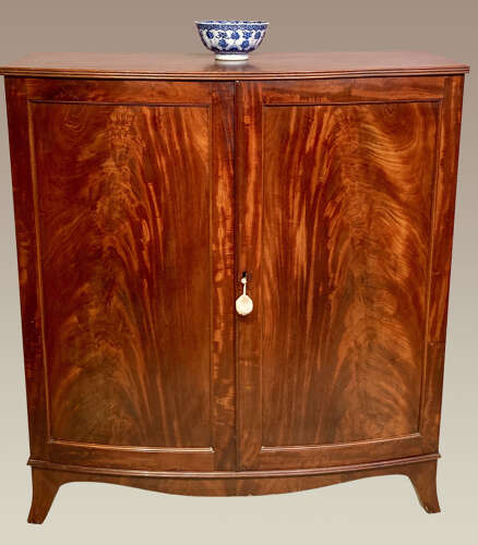 Georgian mahogany bow fronted linen cupboard.