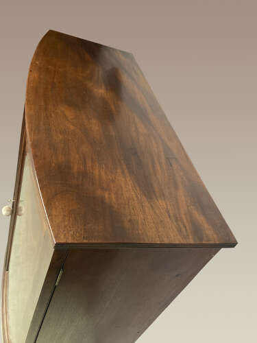 Georgian mahogany bow fronted linen cupboard.