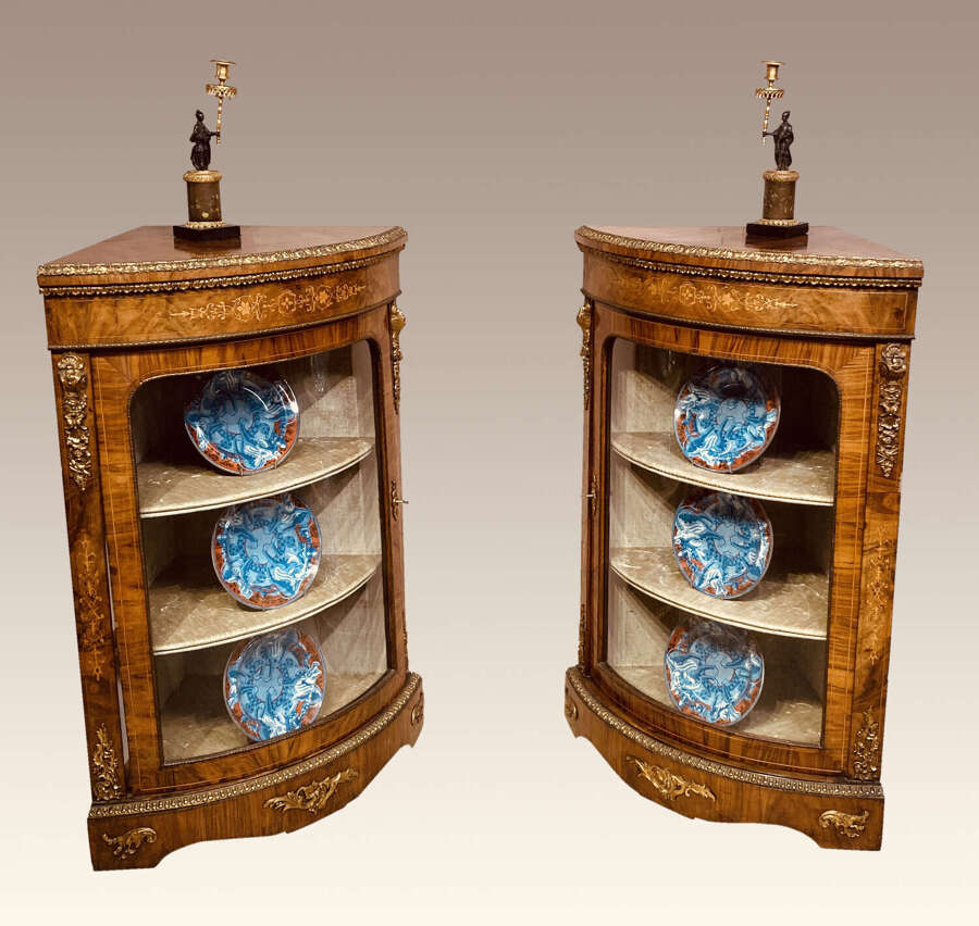 Pair of Victorian inlaid walnut corner cabinets .