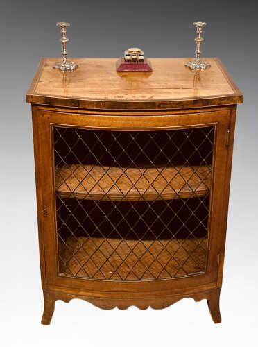 Small Regency bow fronted mahogany side cabinet.
