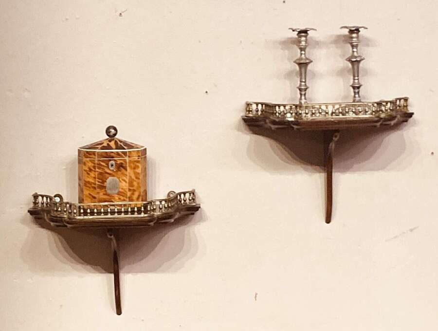 Pair of mahogany hanging wall brackets.
