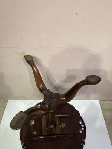 Carved mahogany tilt top tripod table.