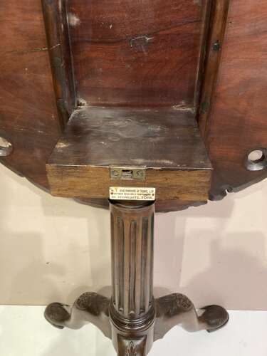 Carved mahogany tilt top tripod table.