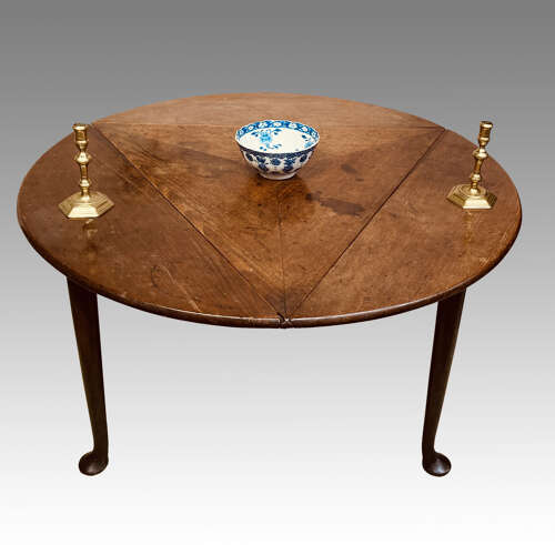 Geo II red walnut drop leaf table.