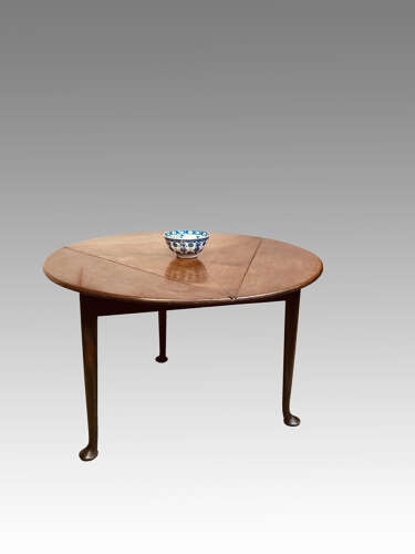 Geo II red walnut drop leaf table.