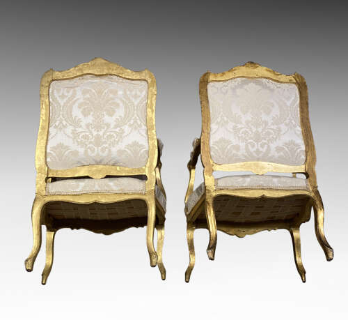 Pair of French carved giltwood armchairs.