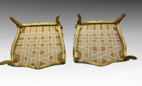 Pair of French carved giltwood armchairs.